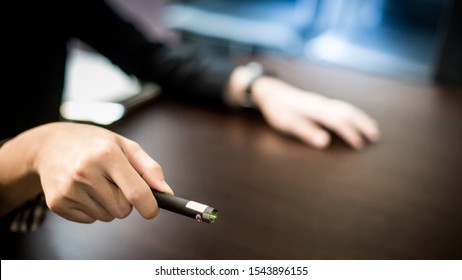 Male Hand Holding Laser Pointer In Meeting Room. Tool For Business Persentation. Teaching Concept