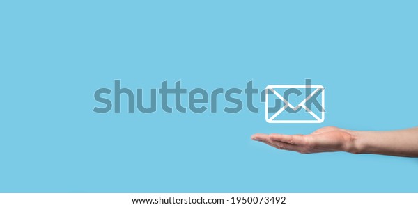 Male hand holding letter icon,email icons\
.Contact us by newsletter email and protect your personal\
information from spam mail. Customer service call center contact\
us.Email marketing and\
newsletter.