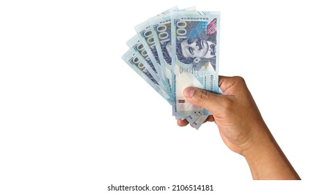 male hand holding new bills in peruvian sol on a white background new bills - Shutterstock ID 2106514181