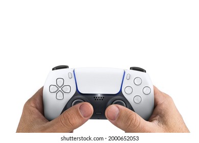 Male Hand Holding A Next Generation White Game Controller Isolated On White Background.