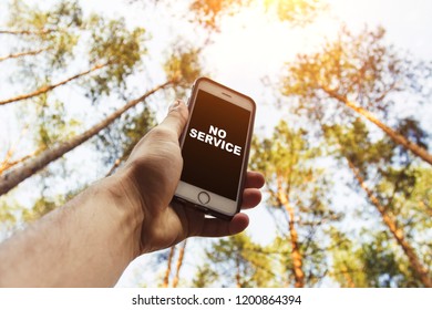 Male Hand Is Holding A Phone With Sign No Service  Above His Hea