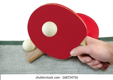 Male Hand Holding A Ping Pong Racket And A Table Tennis Ball Above A Net, Isolated On White