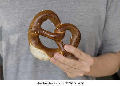 Male Hand Holding A Pretzel