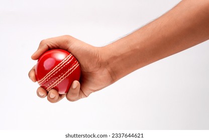 A Male Hand Holding A Red Leather Cricket Ball Isolated On White Background - Powered by Shutterstock