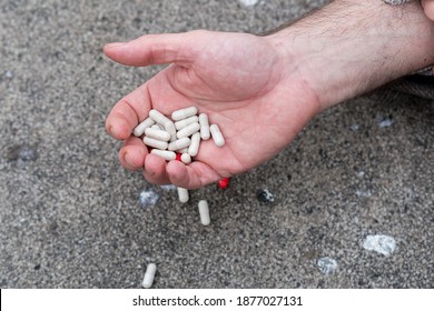 Male Hand Holding Several Pills. Access To Prescription Drugs And Possible Accidental Overdose
