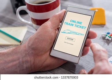 Male Hand Holding A Smartphone With Online Train Ticket Concept