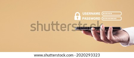 Male hand holding smartphone. Username and Password 