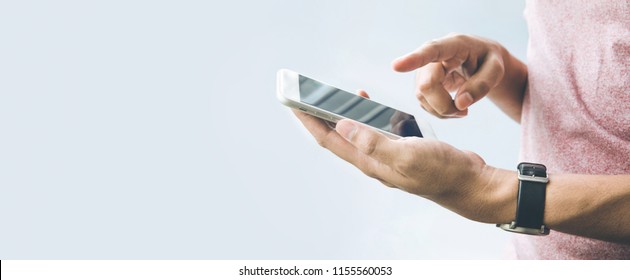 Male Hand  Holding Smartphone,mobile With Copy Space On Banner Size  Background.panoramic Images