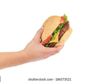 Male hand holding tasty hamburger. Isolated on a white background.