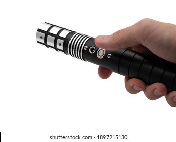 A male hand holds a lightsaber or laser sword isolated on a white background. The hilt of a saber without a colored beam.