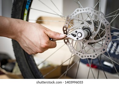 Male Hand Holds The Tool. The Process Of Repairing A Bike. Bicycle Wheel Breakage. Active Lifestyle. Self Repair Bike At Home. Image.