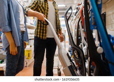 Male Hand Holds Vacuum Cleaner, Electronics Store