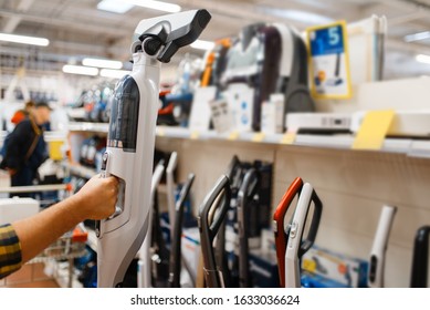 Male Hand Holds Vacuum Cleaner, Electronics Store