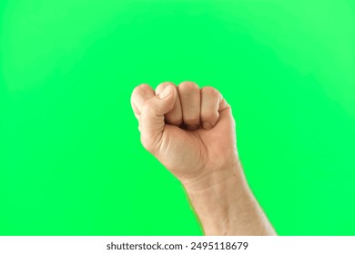 Male Hand Making Rise Up Sign Symbol. Chroma Key Green Screen Background. Gesture Movement. Body Language. 4K Footage. Close Up. Raised Hand. Clenched Closed Fist. Raised Up. Human Equal Rights. Vote - Powered by Shutterstock