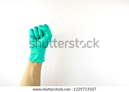 Male hand in medical glove on white background.