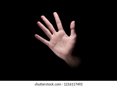 Male Hand With Open Palm Or Five Finger Sign Over Dark Background