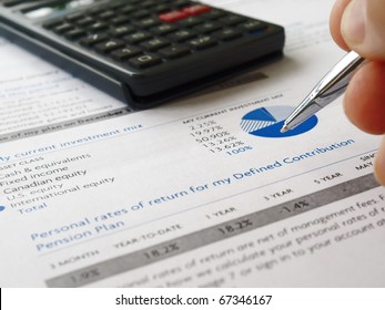 Male hand with pen on the investment chart with calculator