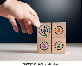 Male Hand Places Wooden Cube With Retargeting Icon. Digital Marketing, Retargeting, Remarketing And Website Visitor Management Concepts.