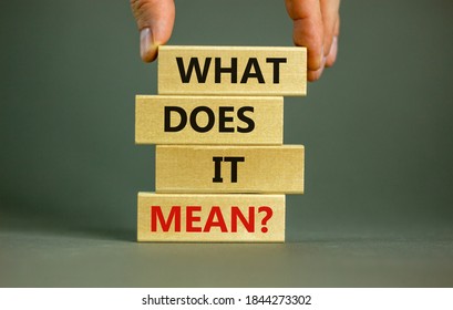 Male hand placing a block with word 'what' on a blocks tower with words 'what does it mean'. Beautiful grey background. Business concept. Copy space. - Shutterstock ID 1844273302