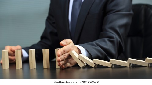male hand placing wooden block on a tower. planing and strategy concept - Shutterstock ID 394990549