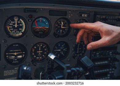 Male Hand Pointing At Aircraft Instrument Panel