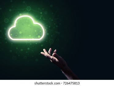 Male hand pointing to the luminous cloud computer concept