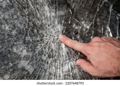 Male Hand Points Broken Window Glass, Close Up Photo