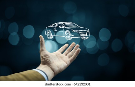 Male Hand Presenting Car Icon On Virtual Screen.