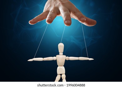 Male Hand, Puppeteer Controls The Puppet Puppet With Strings. The Concept Of Shadow Government, World Conspiracy, Manipulation, Control