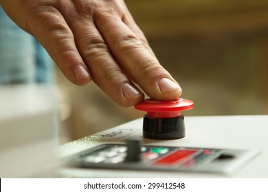 Male hand pushing emergency red stop button. - Shutterstock ID 299412548