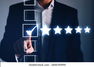 Male Hand Putting Check Mark A Checkbox On Five Star Rating. Increase Rating  Company Concept.