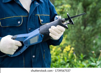male hand with a reciprocating saber saw. construction work. compliance with safety regulations. - Shutterstock ID 1739567537