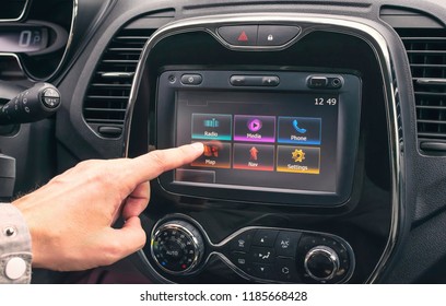 Male Hand Selects A Map On A Multimedia System In The Car