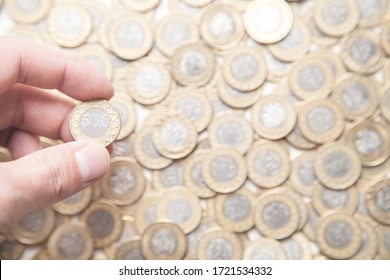 Male Hand Showing Coin. Business