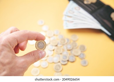 Male Hand Showing Coin. Business. Finance