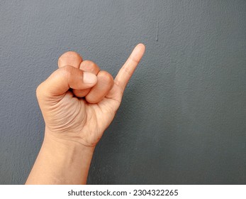 Male hand showing little finger. making promise gesture. isolated on black background.
Space for text - Powered by Shutterstock