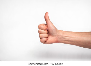 Male Hand Showing Thumbs Up Sign 