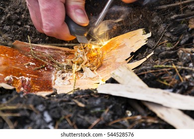 Male Hand Starts Fire With Magnesium Fire Steel, Fire Striker