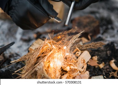 Male Hand Starts Fire With Magnesium Fire Steel, Fire Striker