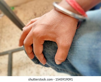 Male Hand With Steel Bangle And Red Sacred Thread 