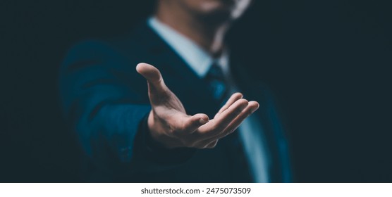 A male hand in a suit shows a palm-up gesture against a gray background, symbolizing concepts of request, bankruptcy, and close-up. - Powered by Shutterstock