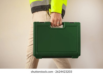 Male hand with Tool Kit Suitcase. Portable Hardware Combination Tool Set for Repair and Maintenance