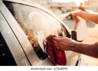 Male Hand With Tool For Washing Windows, Car Wash