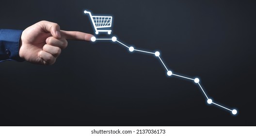 Male Hand Touching Down Graph With A Shopping Cart. Sales Decline