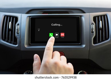 Male Hand Touching Multimedia System With Phone Calling On Screen In Car