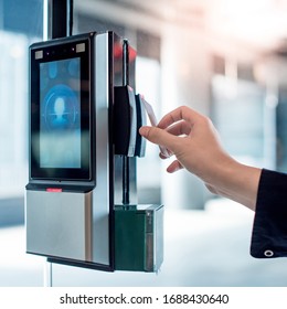 Male Hand Using Key Card To Open Smart Door Lock For Security System On Glass Door In Office Building. Biometric Authentication Device For Privacy And Safety.