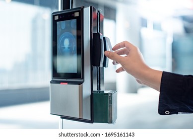 Male Hand Using Key Card To Open Smart Door Lock For Security System On Glass Door In Office Building. Biometric Authentication Device For Privacy And Safety.