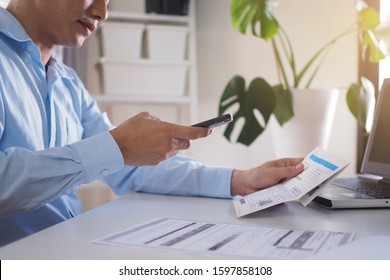 The Male Hand Is Using The Phone To Scan The QR Code To Pay The Bill.    