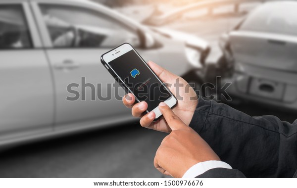 Male\
hand using smart phone and call the car\
insurance.