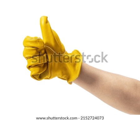 Male hand wearing yellow leather glove on white background. Sign with hand.
